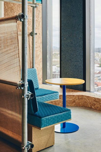 Scaffolding partitions and quilted denim seating