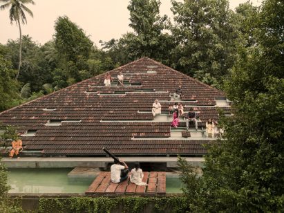 View of Nisarga Art Hub featuring roof seating and performance space