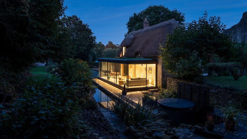 Greenaway Architecture added a contemporary glazed extension to a thatched cottage