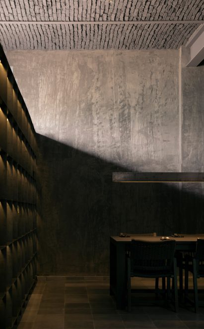 Shadow cast from shelves over the table, with light from windows above