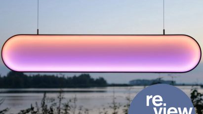 Pink and orange light hanging in front of lake view