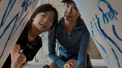 Student with parent viewing a design project