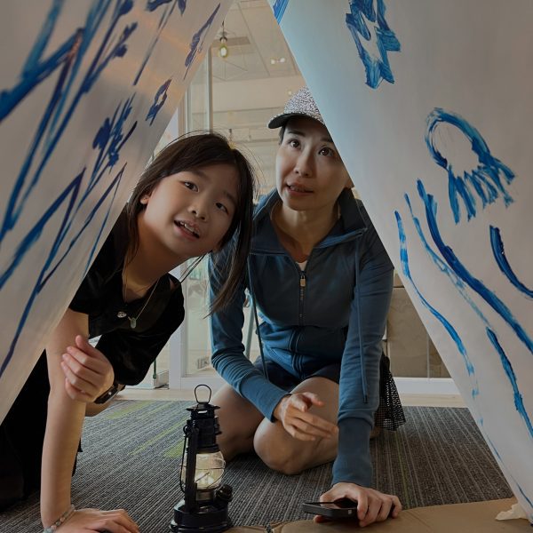 Student with parent viewing a design project