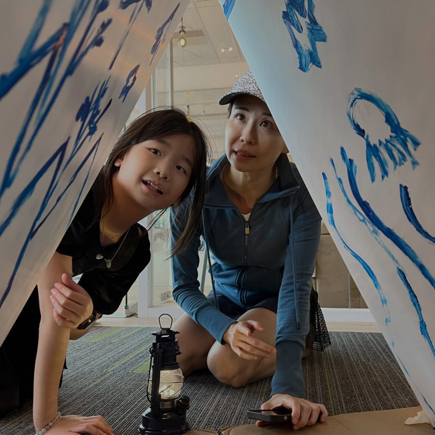 Student with parent viewing a design project