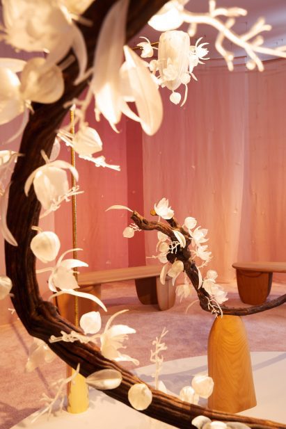 Floral art installation with long branches called The Pollination Dance