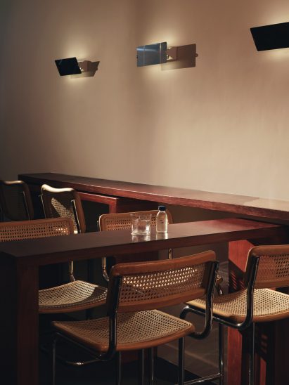 Tall tubular chairs at A Bar with Shapes for a Name by Cake Architecture