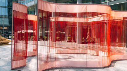 Areen unravels silk fabric for Flowing Threads installation at Dubai Design Week