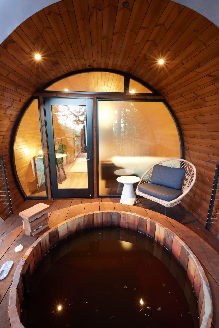 Hot tub in front of cylindrical house