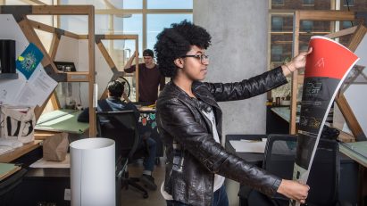 a student at Cleveland Institute of Art is printing a poster