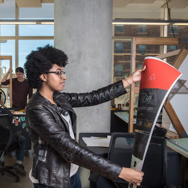 a student at Cleveland Institute of Art is printing a poster