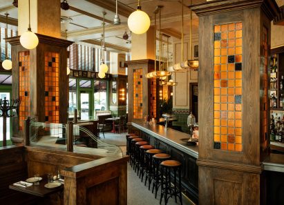 Le Suprême restaurant with zinc bar top, hand-made tiles and mosaic marble flooring