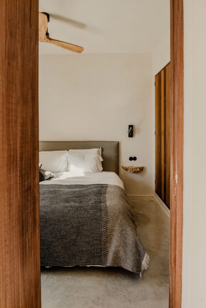 A minimally furnished bedroom with built-in storage