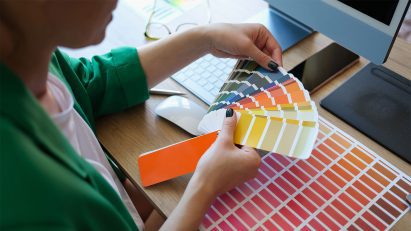 A person looking at a colour chart fan