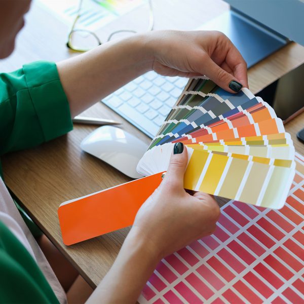 A person looking at a colour chart fan