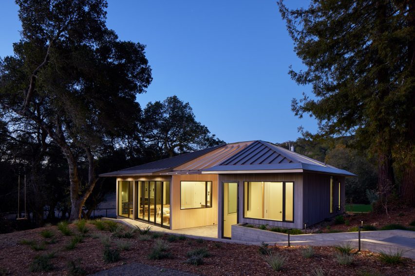 an adu home at night with glowing windows