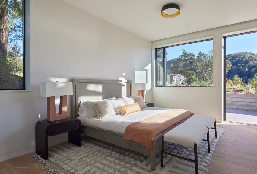 a bedroom with full bed and picture window