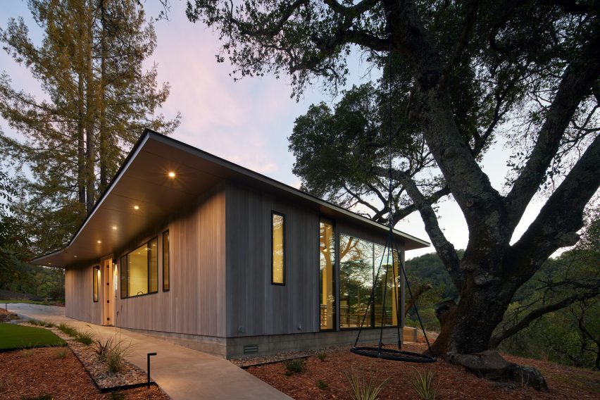 wooden home next to tree