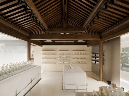 Interior view of FOG Architecture's To Summer fragrance store revealing the wood columns and trusses