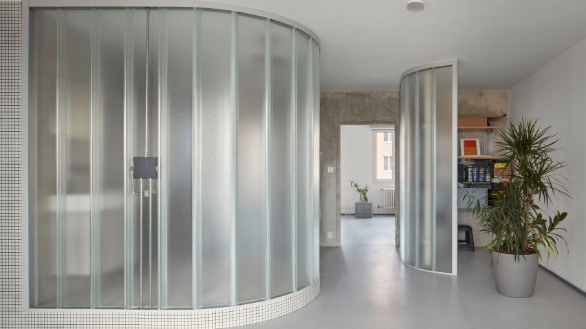 Neuhäusl Hunal renovate apartment in Prague using curved glass walls