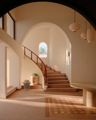 Cavernous corridor with a curved staircase