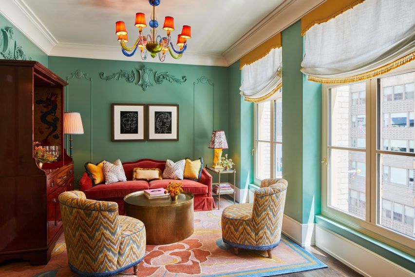 Green walls and ornate fittings and fixtures