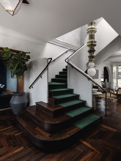 Staircase with green carpets