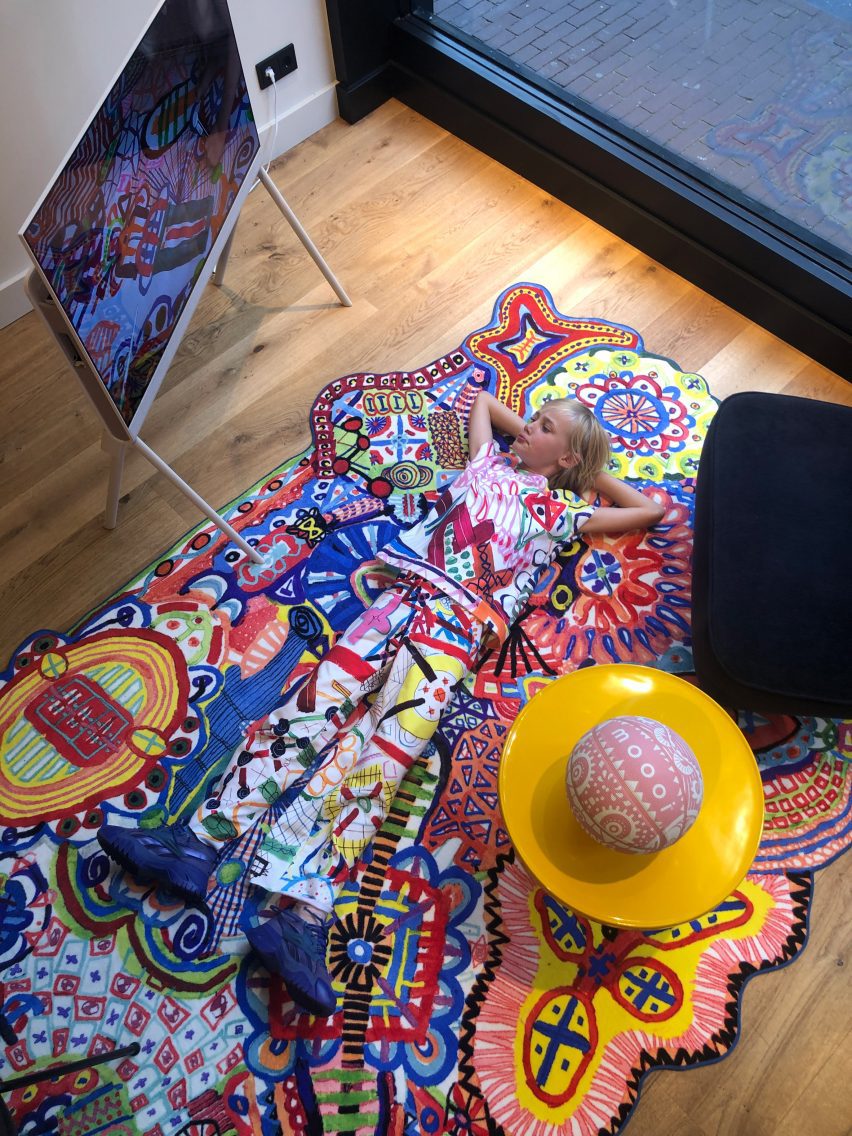Alf Bärbel Wit lying on a LinesLinesLines rug
