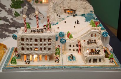 a building covered in snow and penguins