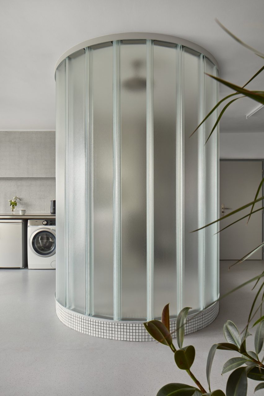 Neuhäusl Hunal renovate apartment in Prague using curved glass walls