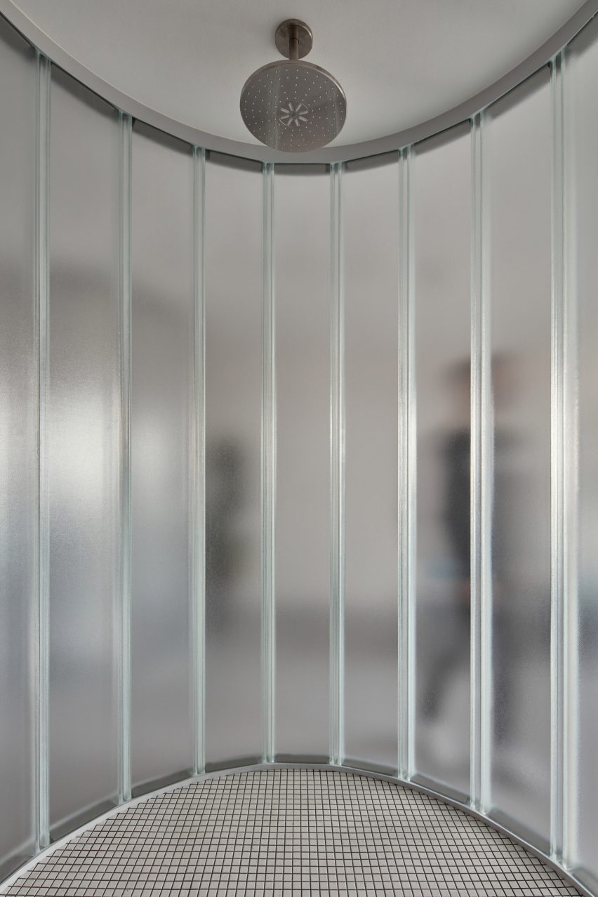 Neuhäusl Hunal renovate apartment in Prague using curved glass walls