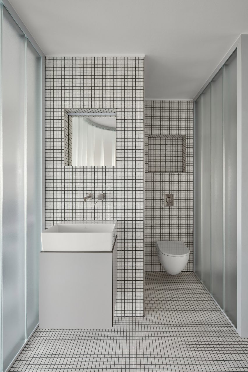 Neuhäusl Hunal renovate apartment in Prague using curved glass walls