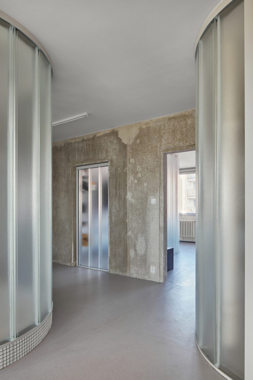 Neuhäusl Hunal renovate apartment in Prague using curved glass walls