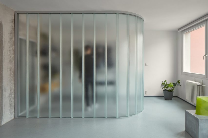Neuhäusl Hunal renovate apartment in Prague using curved glass walls