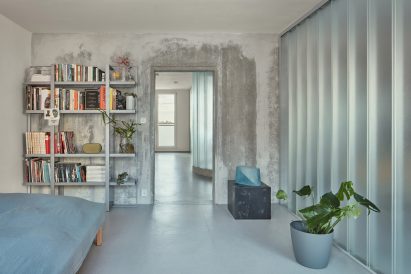 Curved glass partitions divide bedroom interior of Sculptor's Apartment
