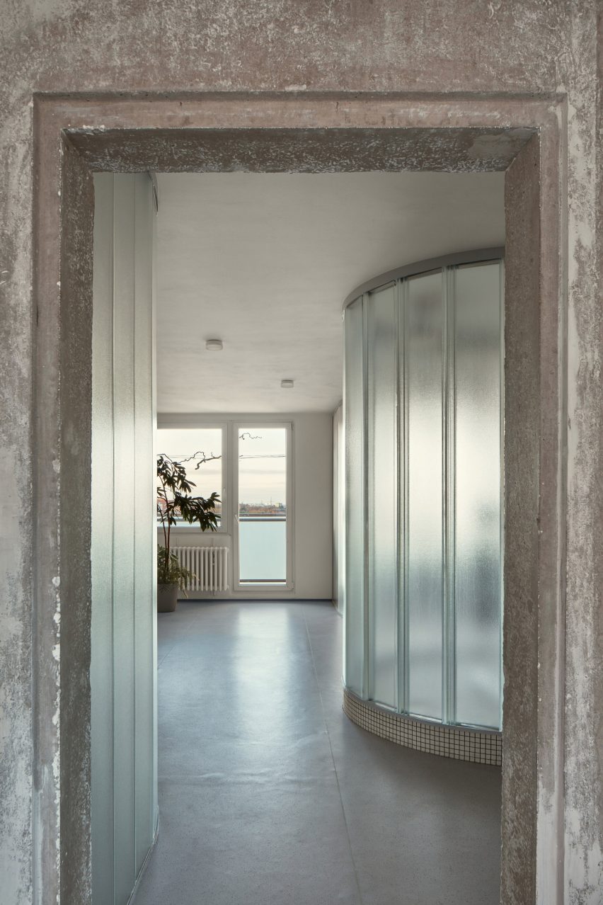 Neuhäusl Hunal renovate apartment in Prague using curved glass walls