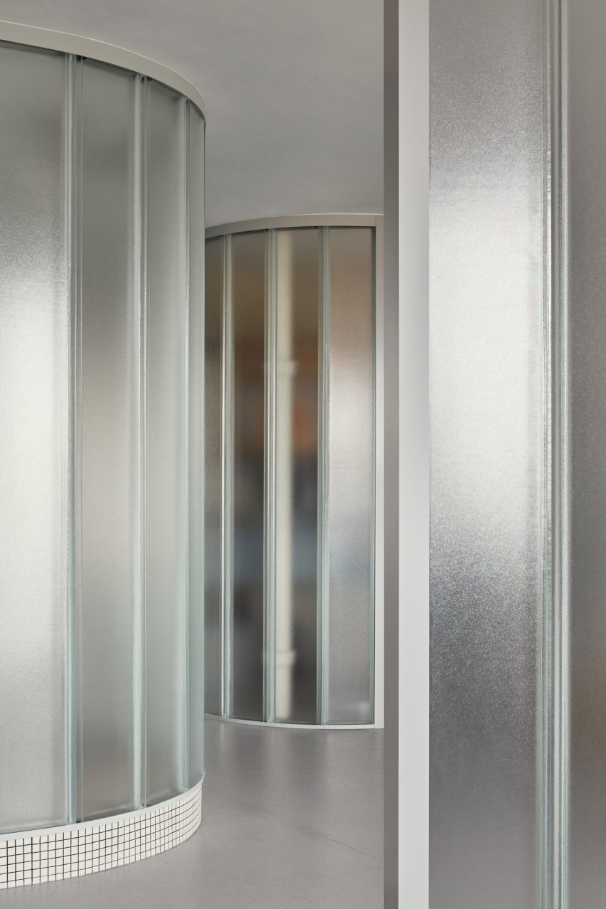 Neuhäusl Hunal renovate apartment in Prague using curved glass walls