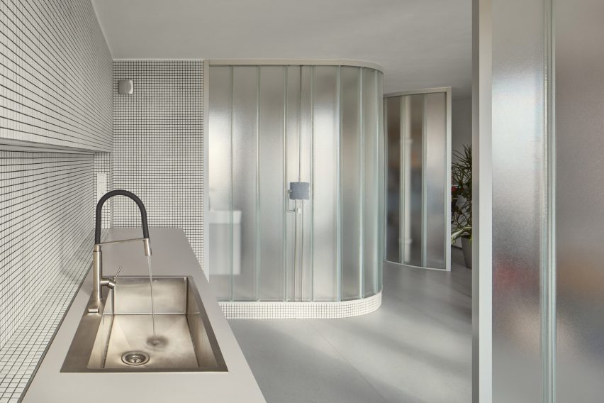 Neuhäusl Hunal renovate apartment in Prague using curved glass walls