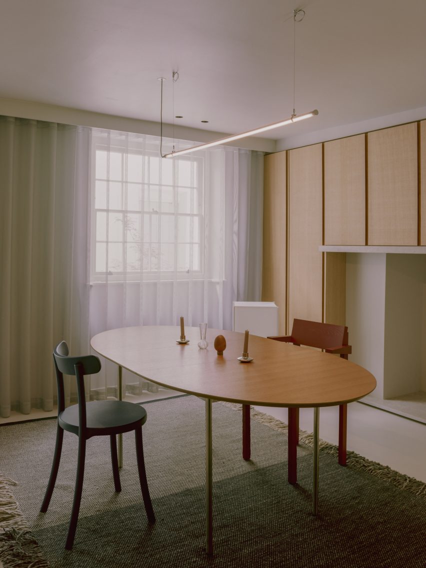 Dining room with a wood table and wood wall cupboards