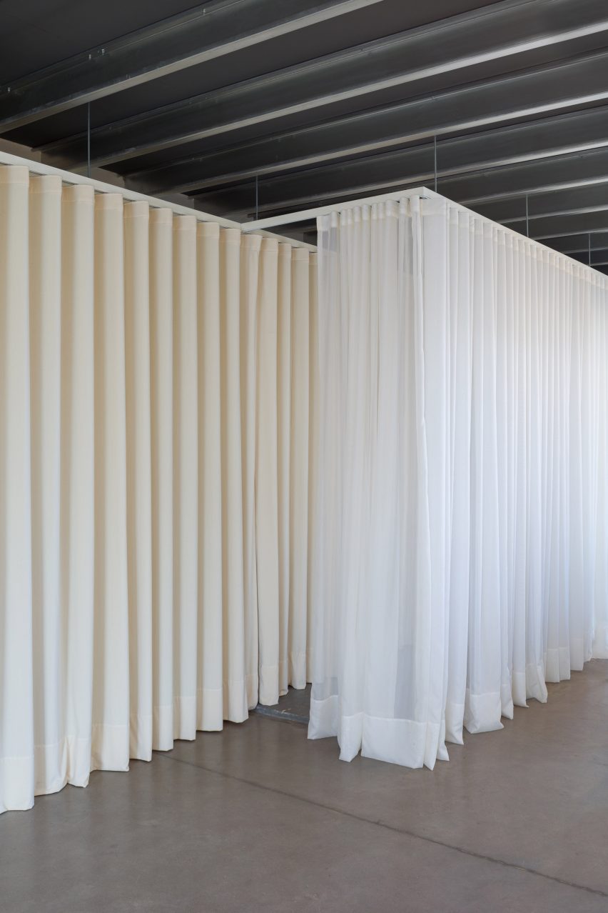 white curtains hanging from a metallic ceiling