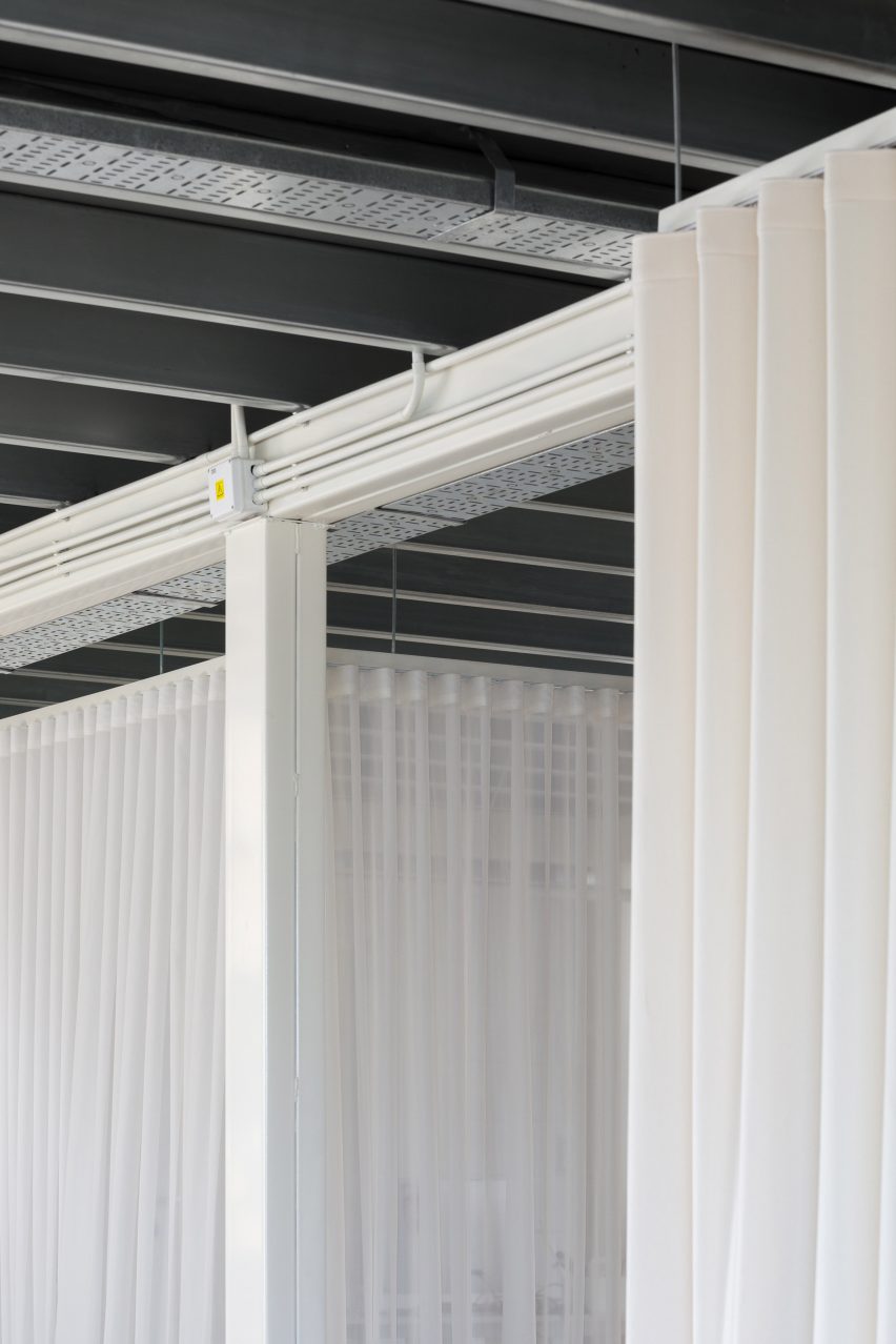 white curtains hanging from ceiling