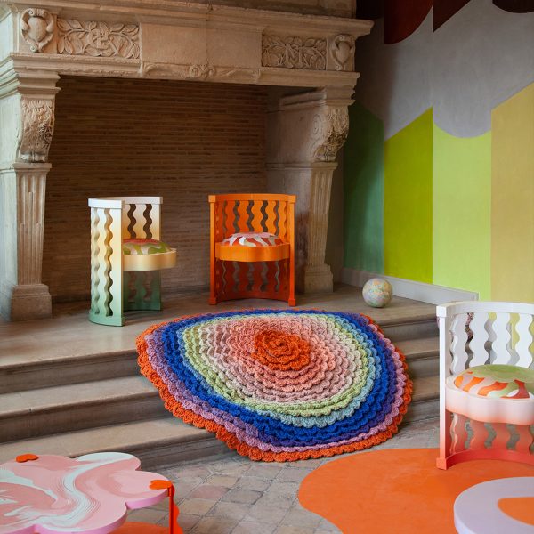Brightly coloured chairs and a CC-Tapis rug presented in Uchronia's Think Pink installation