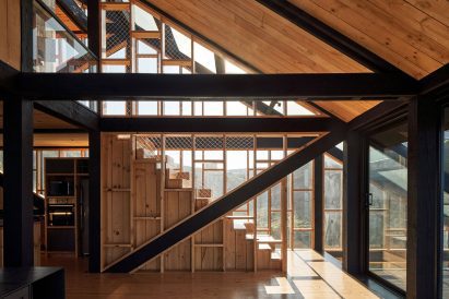 Geometric staircase within home by WMR Arquitectos