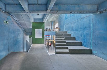 Blue concrete walls within the community centre