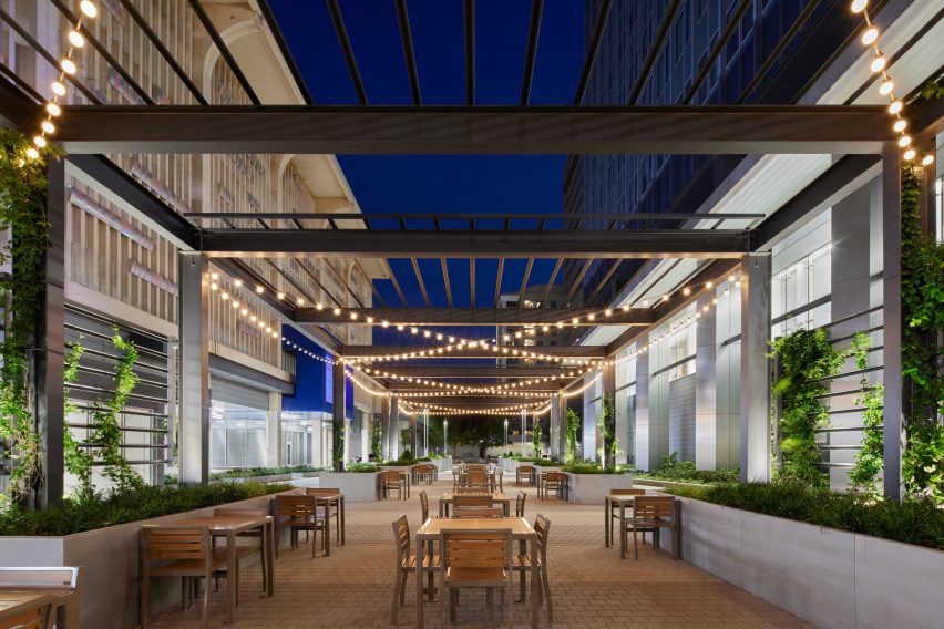 a plaza and seating area at night