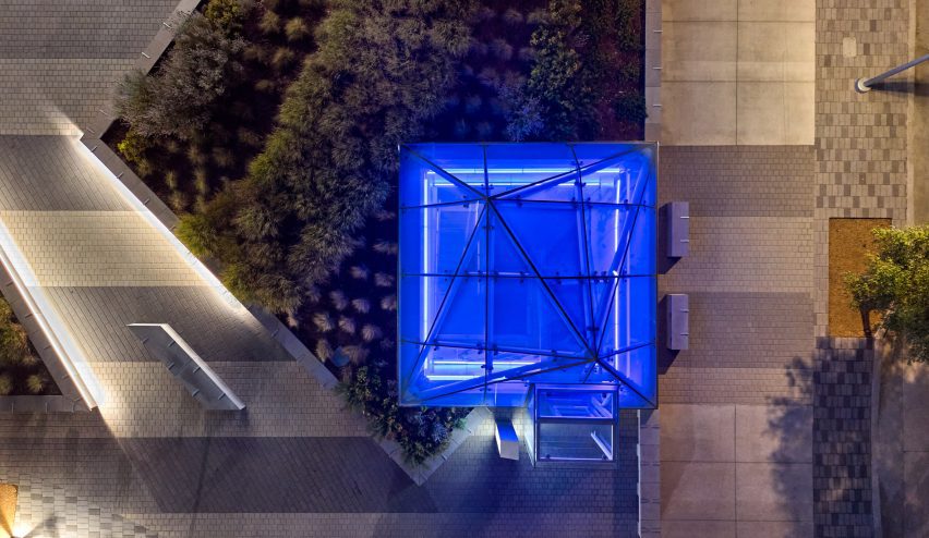 a pyramid that is lit up with blue lighting