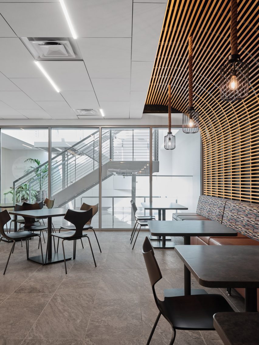 a seating area with wooden wall