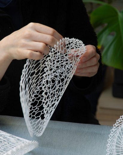 Close up image of someone constructing the volumetric installation