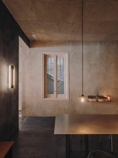 Lounge area inside bakeshop by Plantea Estudio