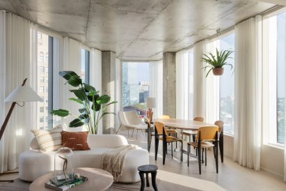 Concrete interior of triangular skyscraper apartment