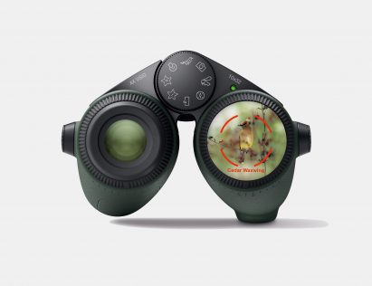 Image of the AX Vision binoculars with a rendering of how the AI bird identification feature appears in augmented reality over one lens